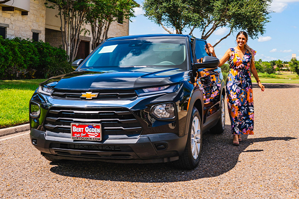 woman walking around her new chevy