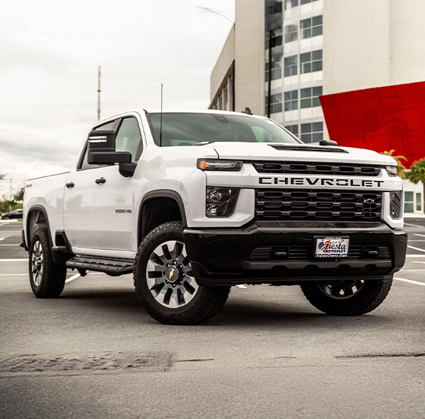 Fiesta Chevrolet Silverado truck parked outside a modern building
