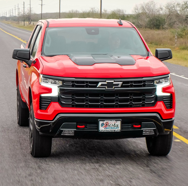 Fiesta Chevrolet Silverado truck driving down the road