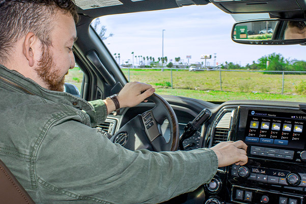customer enjoying the interior of their new nissan titan