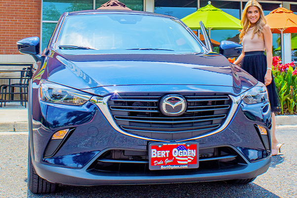 happy customer opening the door of their new 2021 mazda cx-3