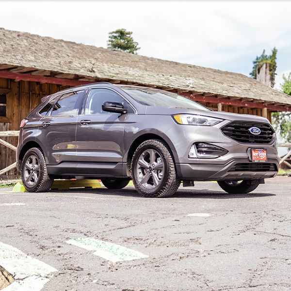 New Bert Ogden SUV parked in front of a country store