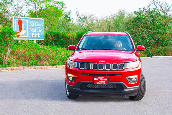 woman sitting in her new 2021 jeep compass
