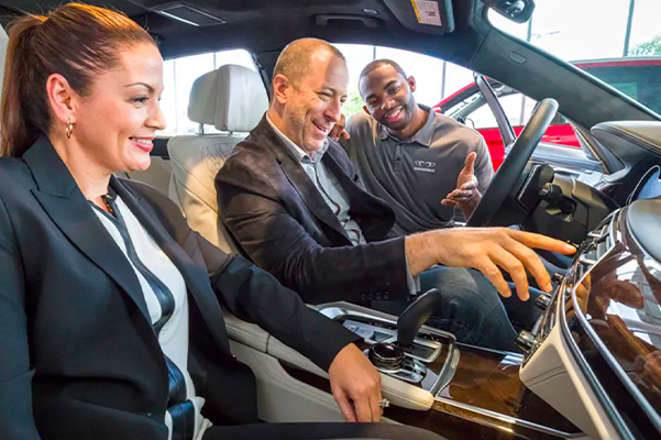 happy couple enjoying their new BMW