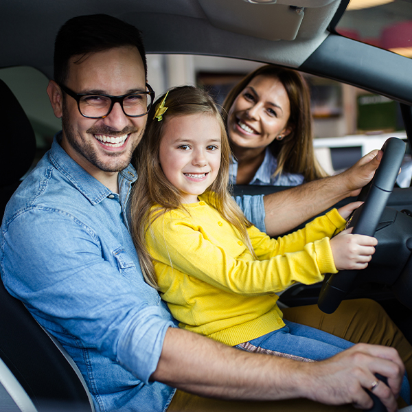 family sitting in their new ford