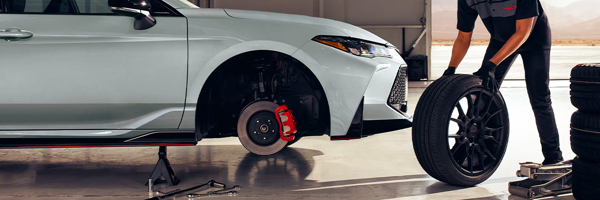 Toyota Service Tech putting a new tire on
