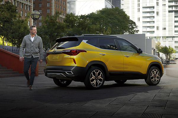 New car buyers riding in their new kia