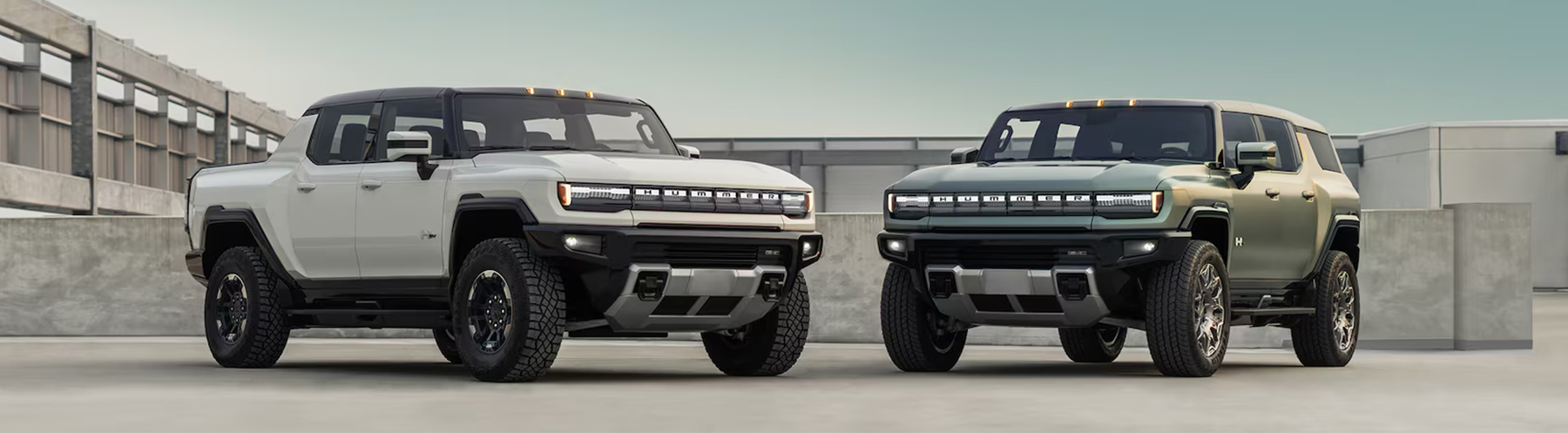 Hummer EV SUV & Pickup Parked in an Industrial Area