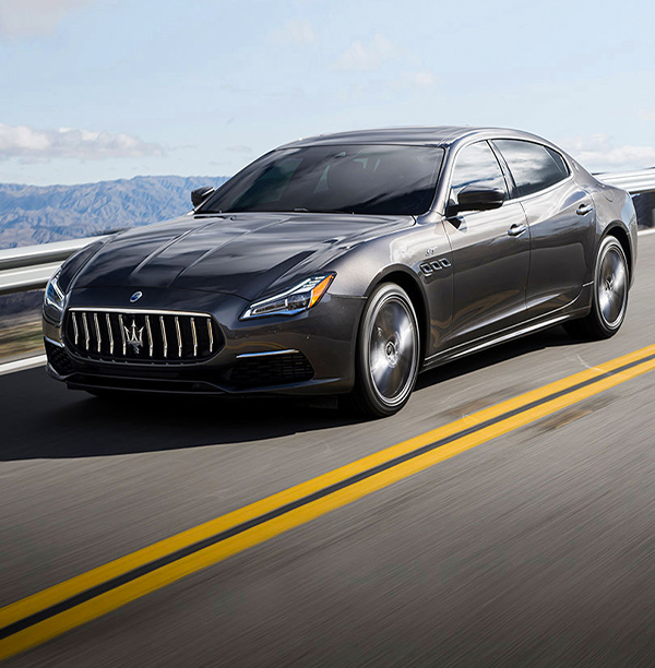 2022 Maserati Quattroporte driving down highway.